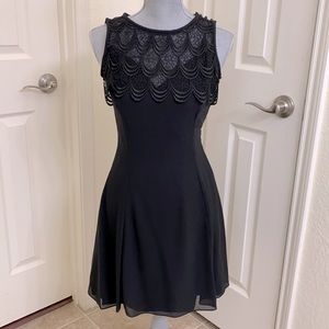 Black cocktail dress by Scott McClintock